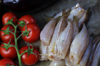 Fried whiting and roast tomatoes
