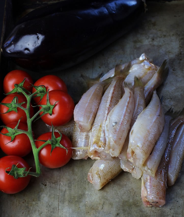 Fried whiting and roast tomatoes