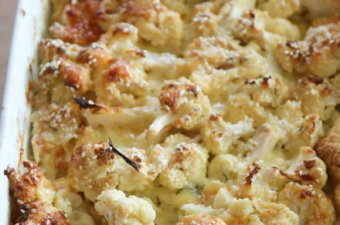 Cauliflower Cheese with Thyme in a white baking dish