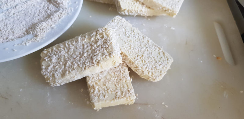 Sliced Tofu crumbed with flour ans sesame seeds