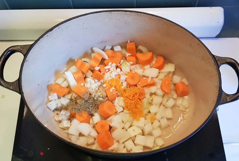 The chopped ingredients for one pot chicken in a casserole dish