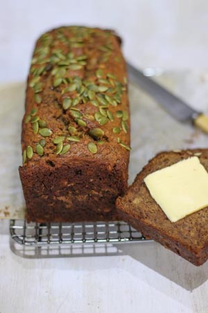 A loaf of banana bread with a slice cut