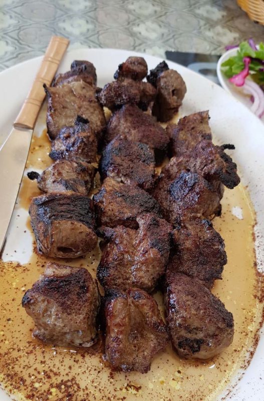 Lamb kebab on a white plate