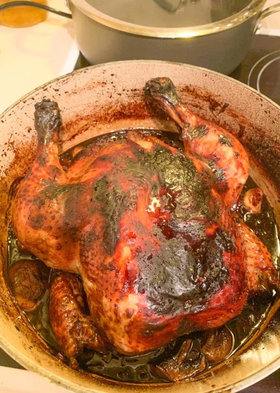 roasted chicken with soy and honey in a blue pot