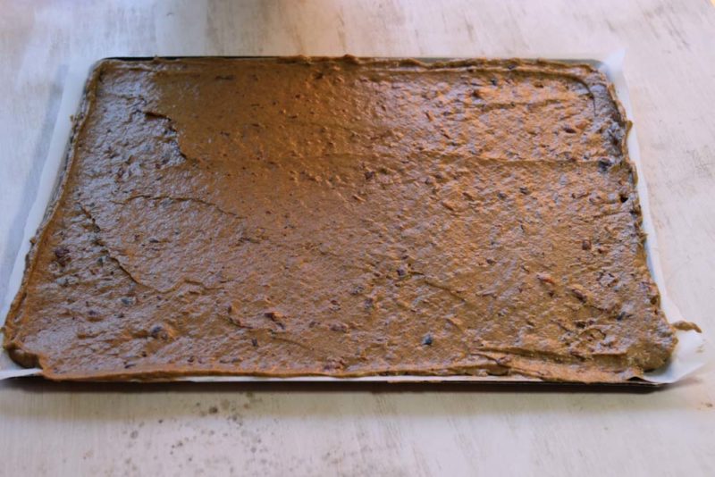 date sponge spread onto a tray for baking