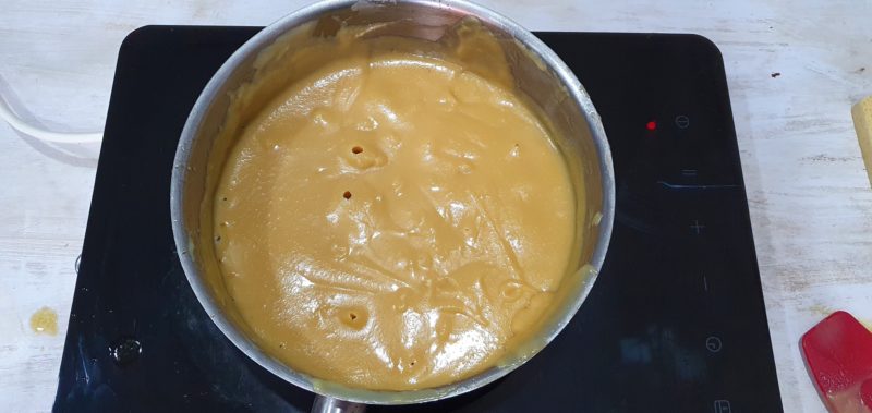 boiling caramel in a pot