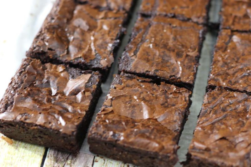 Chocolate slice of brownies all cut up on a tray