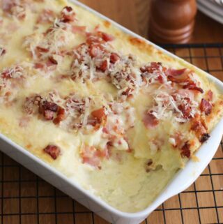Potato-with-parmesan-and-bacon-in-a-white-dish.jpg